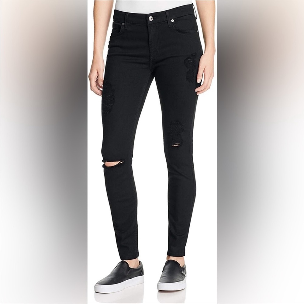 Black distressed skinny jeans.